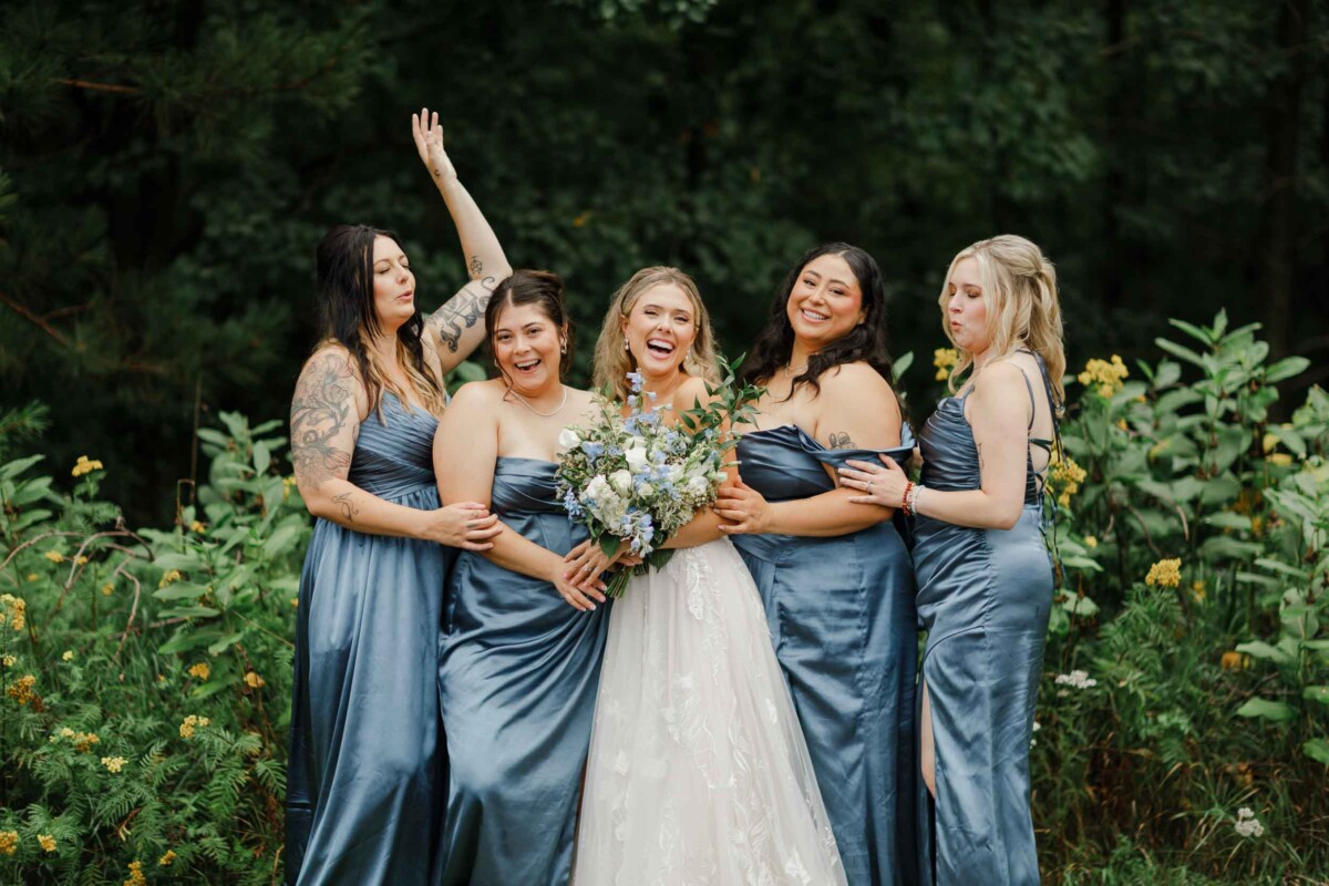 Bridesmaids and bride celebrating at an outdoor Wisconsin wedding near Minocqua.