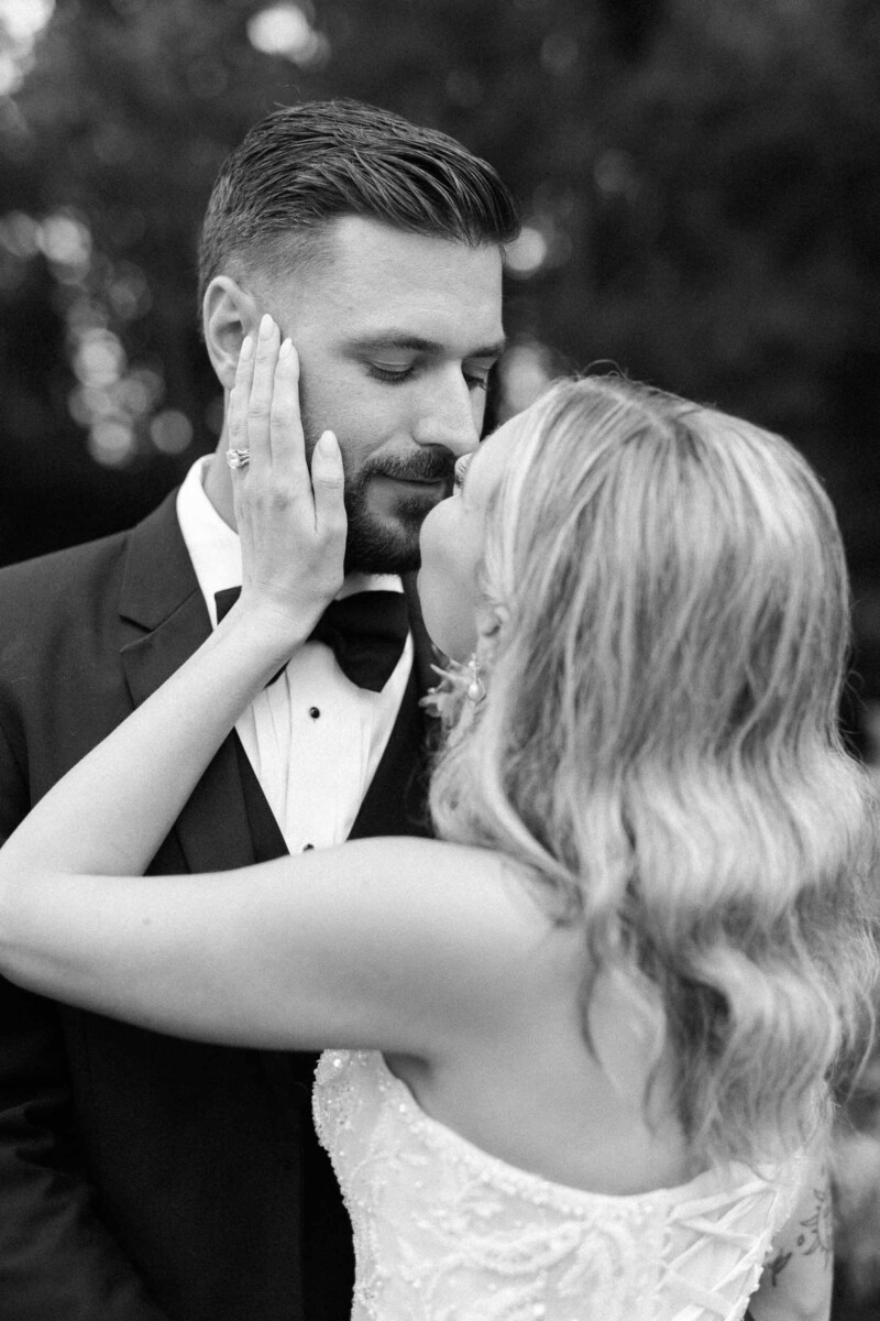 Wedding couple sharing an intimate moment outdoors in Wisconsin.