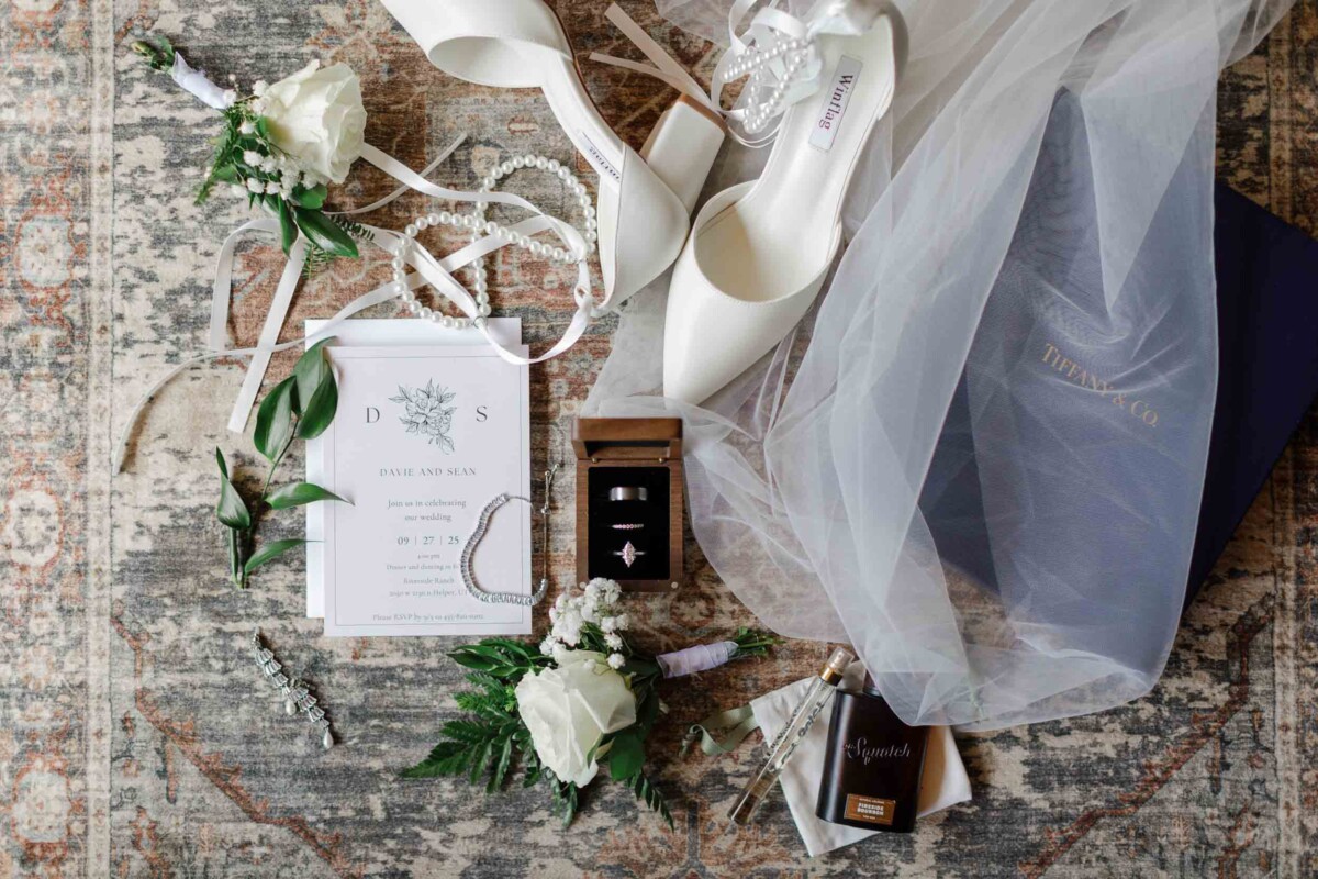 Elegant wedding shoes, flowers, and invitation for Sean & Davie's Utah fall wedding.