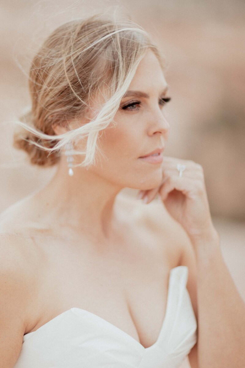 Close-up of a bride with soft makeup and elegant hairstyle in Moab Utah.
