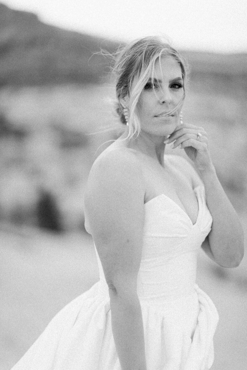 Bride in wedding dress with natural landscape background.