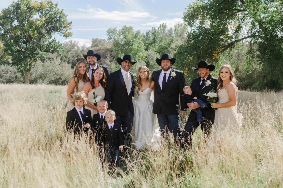 Family group portrait at a rustic outdoor wedding in Utah.