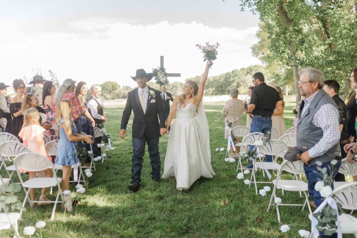 Bride and groom walk down the aisle after their wedding vows.
