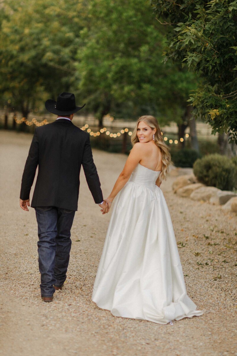 Utah fall wedding of Sean and Davie, romantic couple walking outdoors.