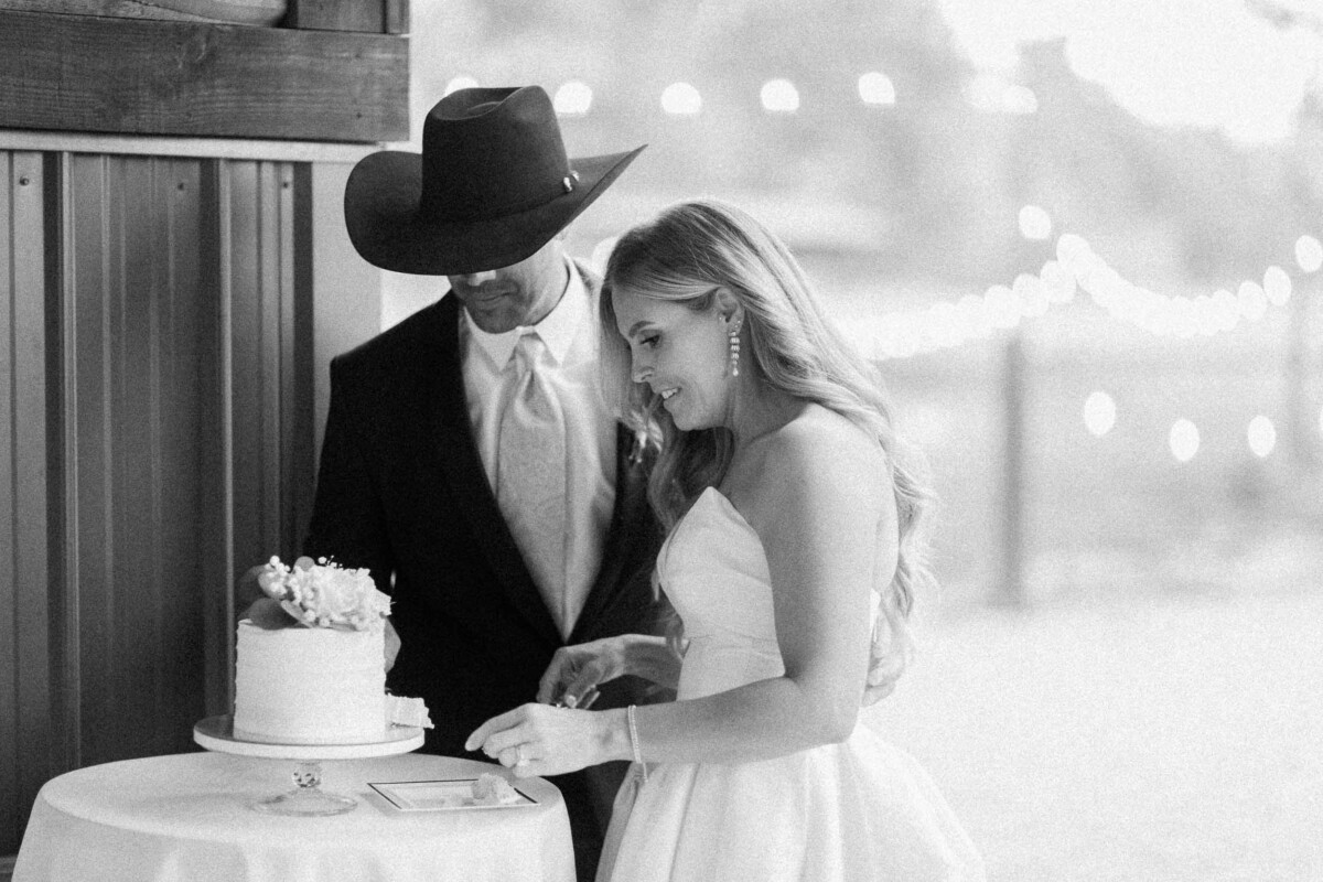 Wedding couple cutting cake at rural Utah wedding.