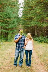 Couple in the woods with ferns