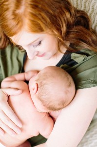 mom holding baby photo