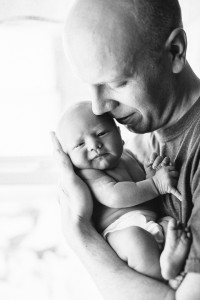 black and white baby photo with dad