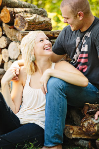 Couple by wood pile photo