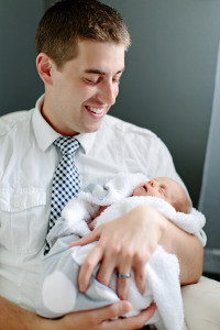 Father holding newborn son