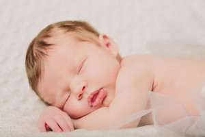 Sleeping newborn baby girl