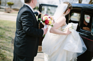 bride in vintage old model a car for wedding photo