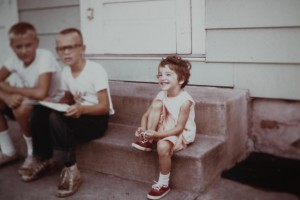 Polaroid images from the 50s little girl with red shoes on porch