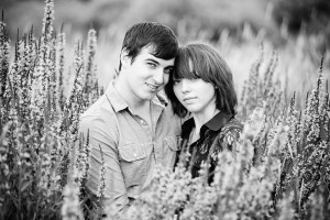Kissing in a field engagement photo ideas