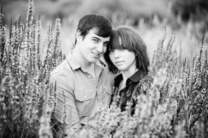 Kissing in a field engagement photo ideas