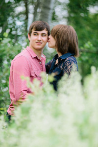 Kissing in a field engagement photo ideas