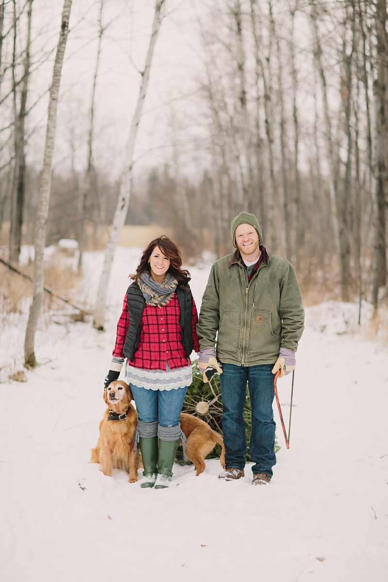Winter Stylized Christmas Tree Cutting Shoot with dogs in the snow photos taken in Northern Wisconsin by James Stokes Photography