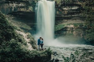 Engagement photo by waterfall - Wisconsin photographer