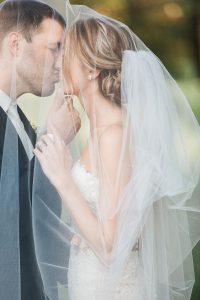 Bride and groom kissing during half-day wedding photography shoot in Wisconsin.