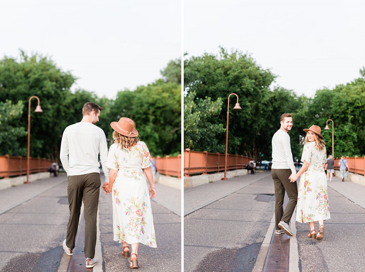 couple walking cobblestone roads