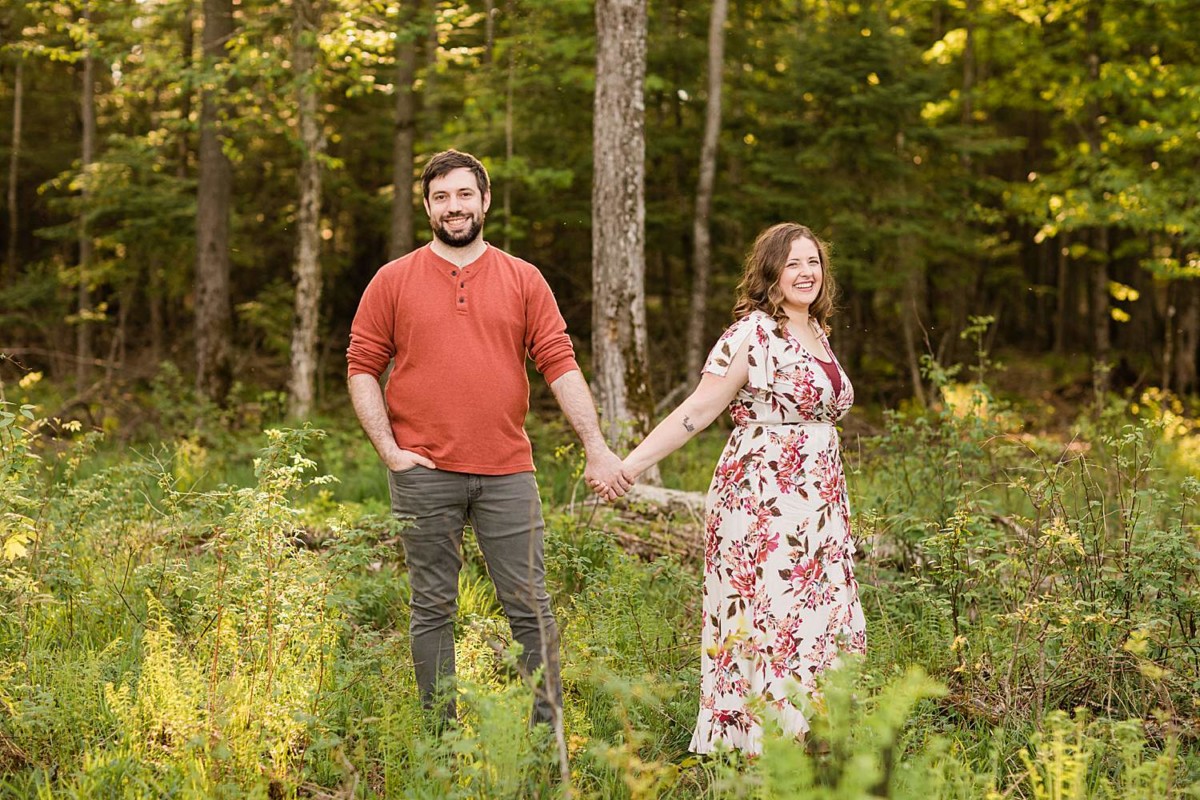 Chequamegon-Nicolet National Forest Engagment Photos of a couple holding hangs in the forest