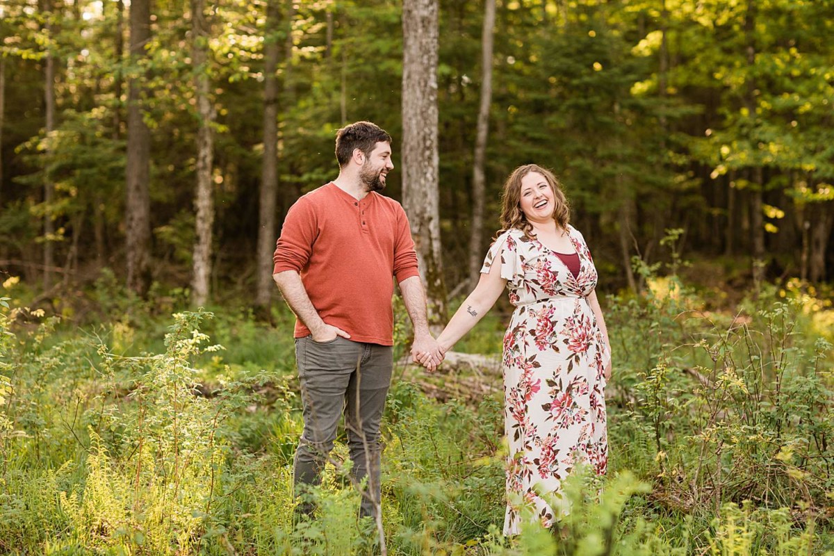 Chequamegon-Nicolet National Forest Engagment Photos of a couple holding hangs in the forest