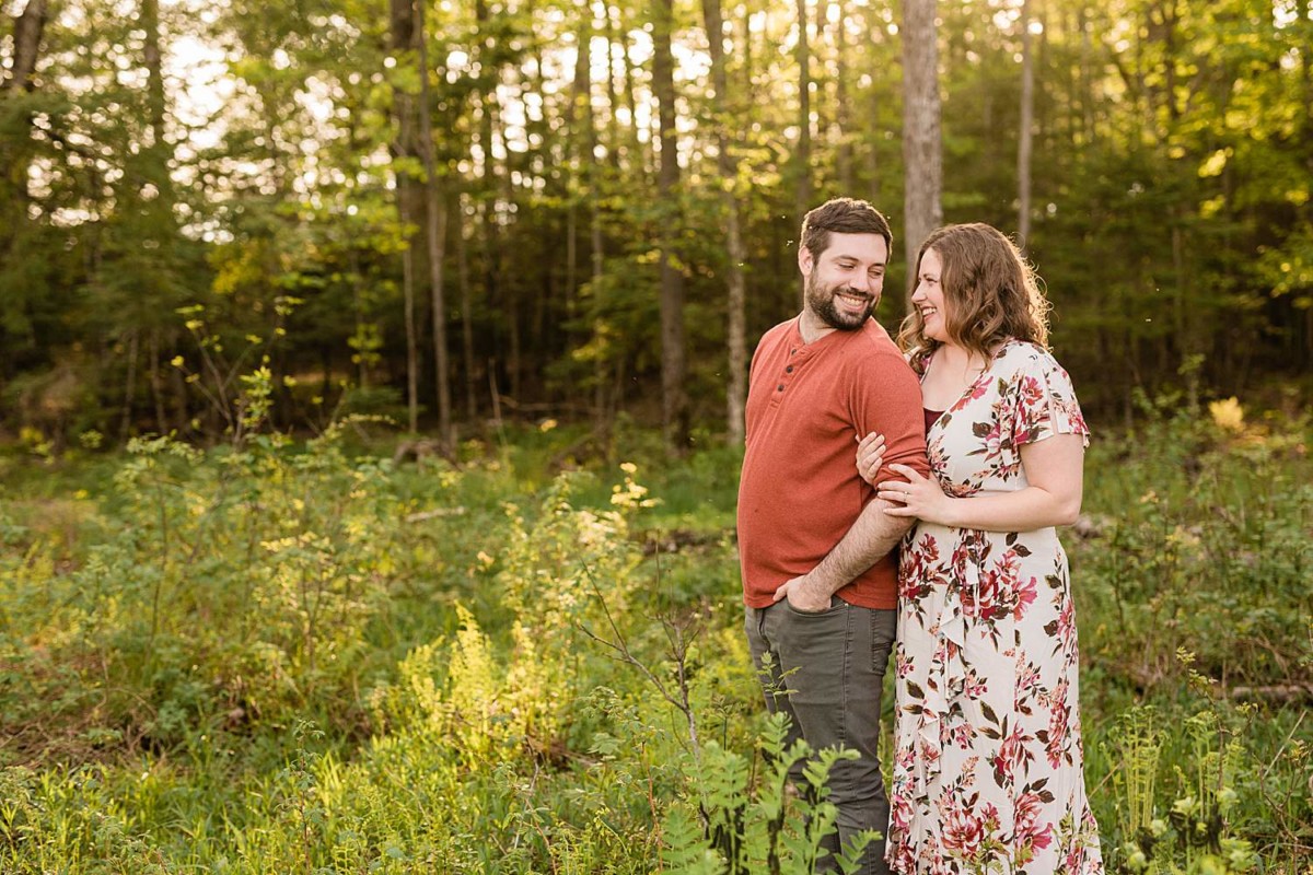  Northern Wisconsin Engagement Photographers couples in the woods embracing 
