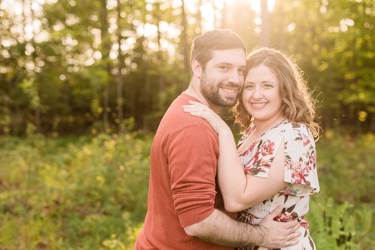  Northern Wisconsin Engagement Photographers couples in the woods embracing 