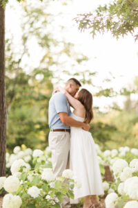 Couple kissing during photo shoot at botanical gardens at one of the best Engagement photoshoot locations in Wisconsin.