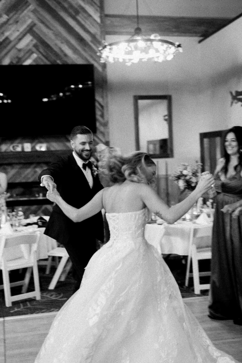 Bride and Groom celebrating during Midwest wedding photography shoot in Monocqua, Wisconsin.