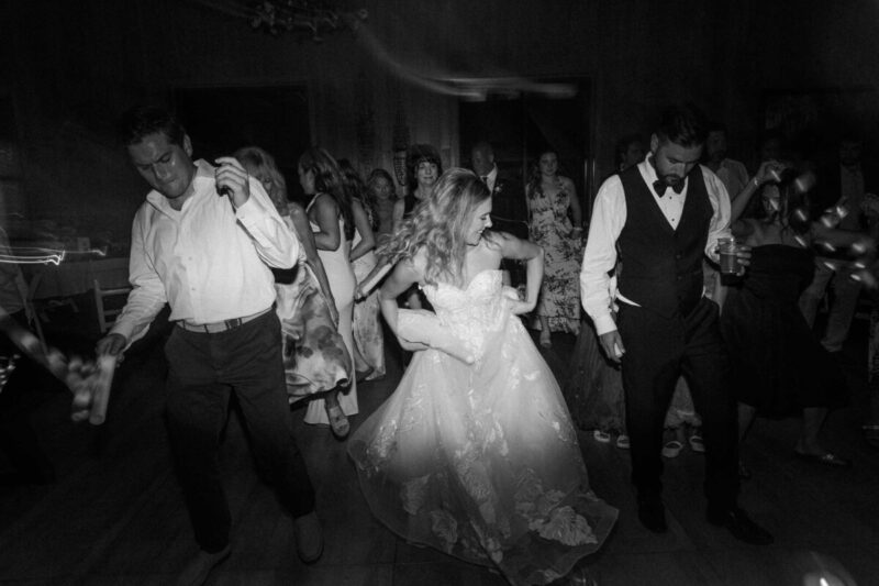 Bride dancing during midwest wedding photography shoot in Wisconsin.