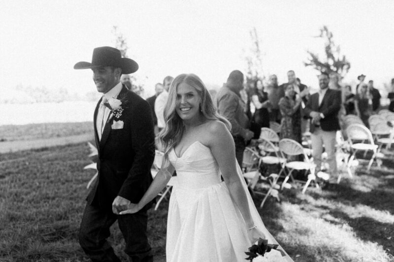 Couple walking down the aisle in Midwest cinematic photography shoot.