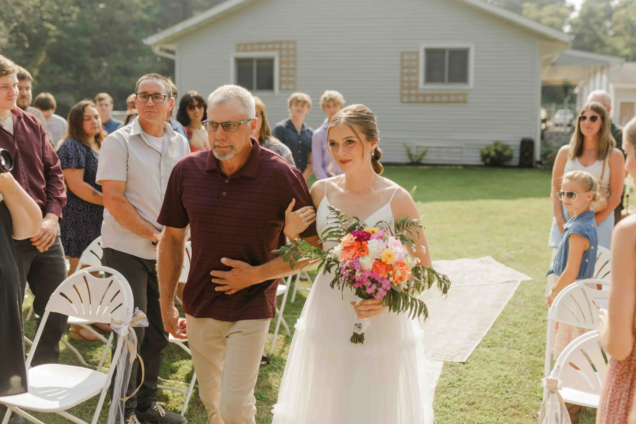 Ceremony moment at intimate backyard wedding in Wisconsin Dells